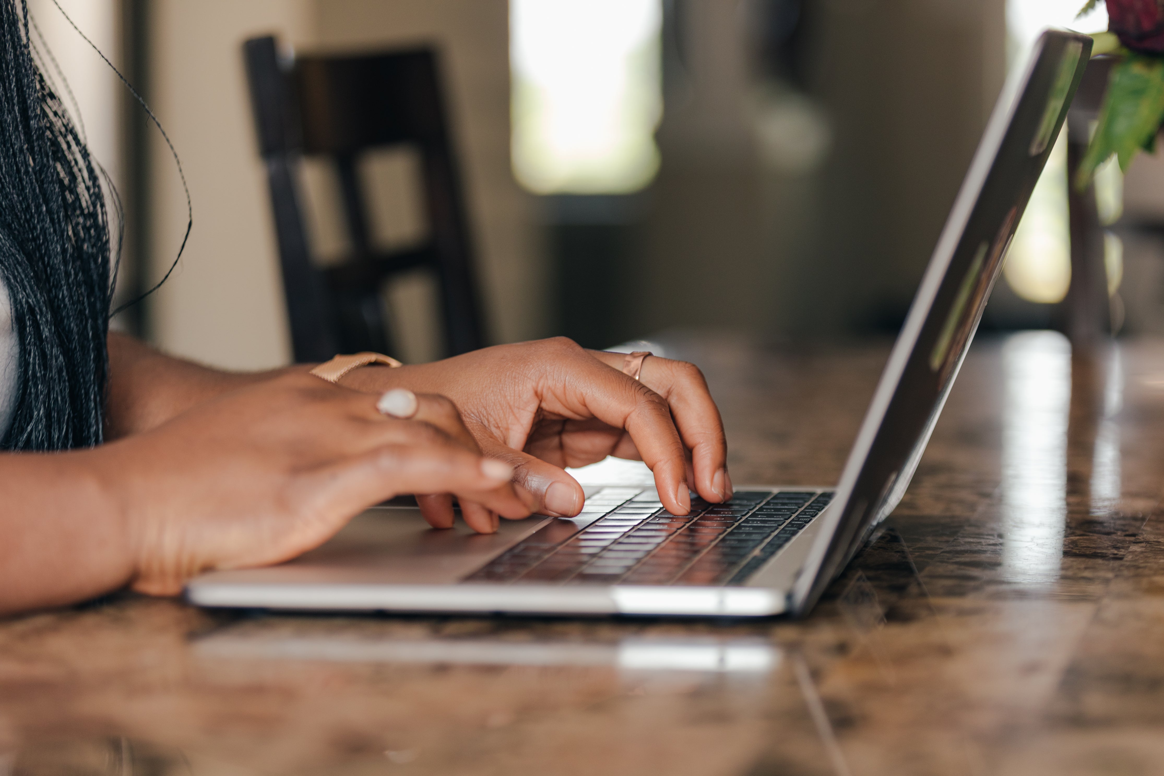 a-pair-of-hands-typing-away